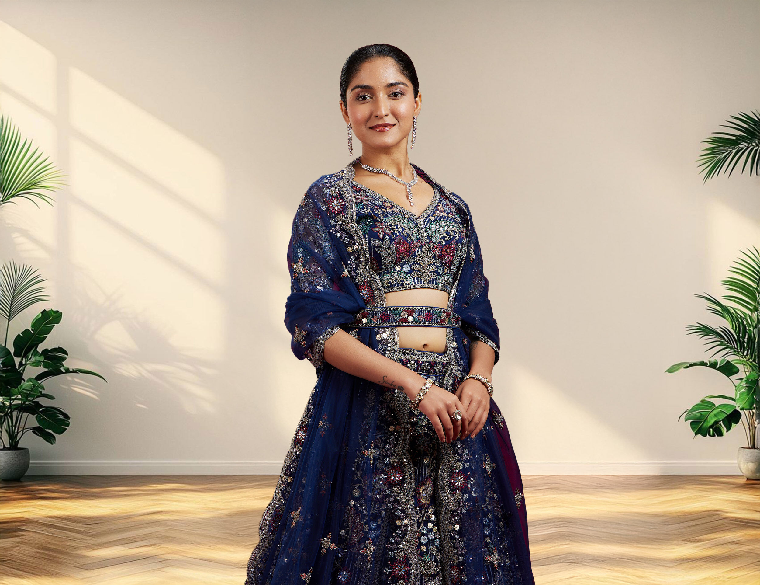 Woman wearing elegant lehengas with two contrast dupattas